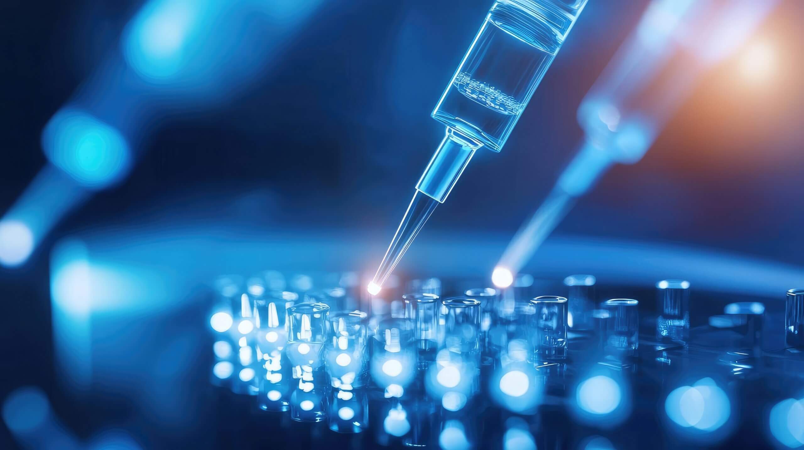 Close up of a syringe extracting liquid from a vial, showcasing advanced technology in healthcare and medical research.